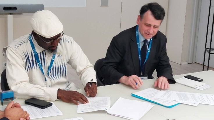 Didier Coulomb signing the memorandum